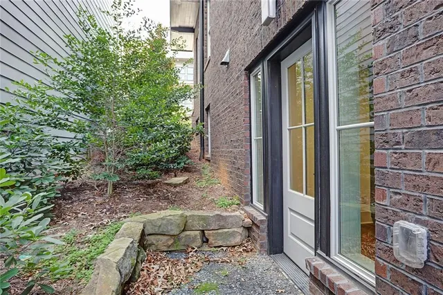 a backyard of a house with outdoor seating