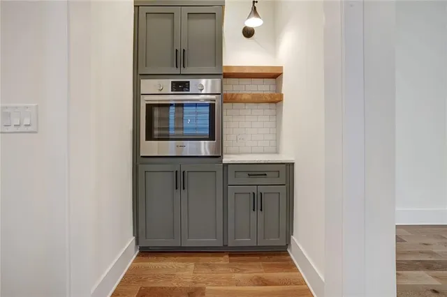 a view of a kitchen from the hallway