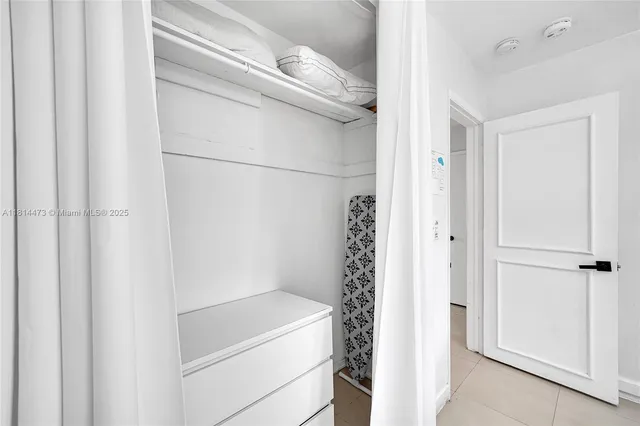 a lobby with furniture and floor to ceiling window