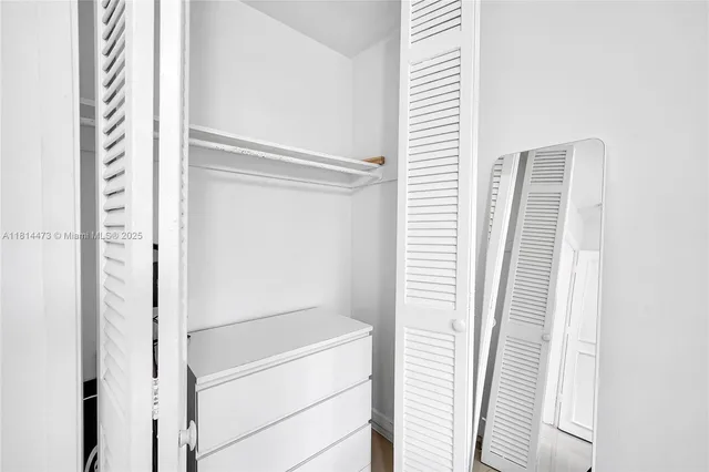a bathroom with a shower sink and mirror