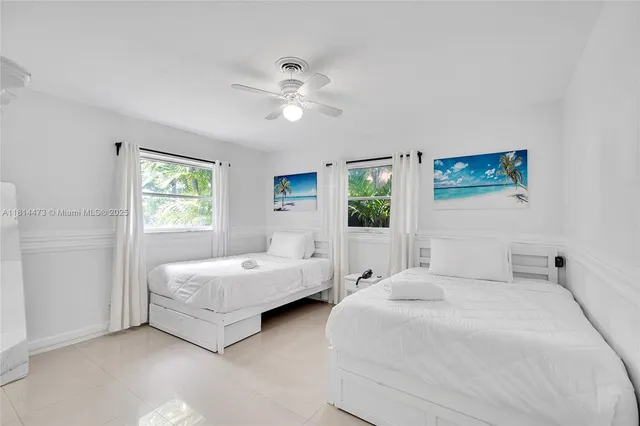 a bathroom with a toilet a sink and shower