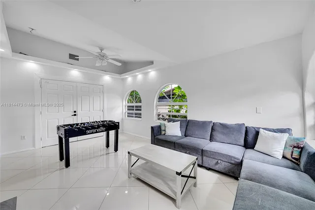 a view of a patio with table and chairs with wooden floor and fence