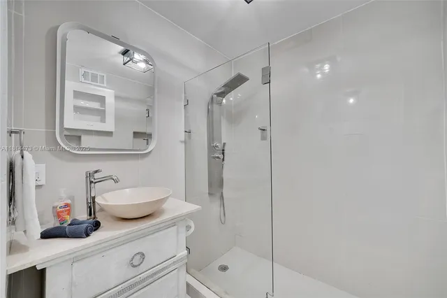 an aerial view of residential houses with city view