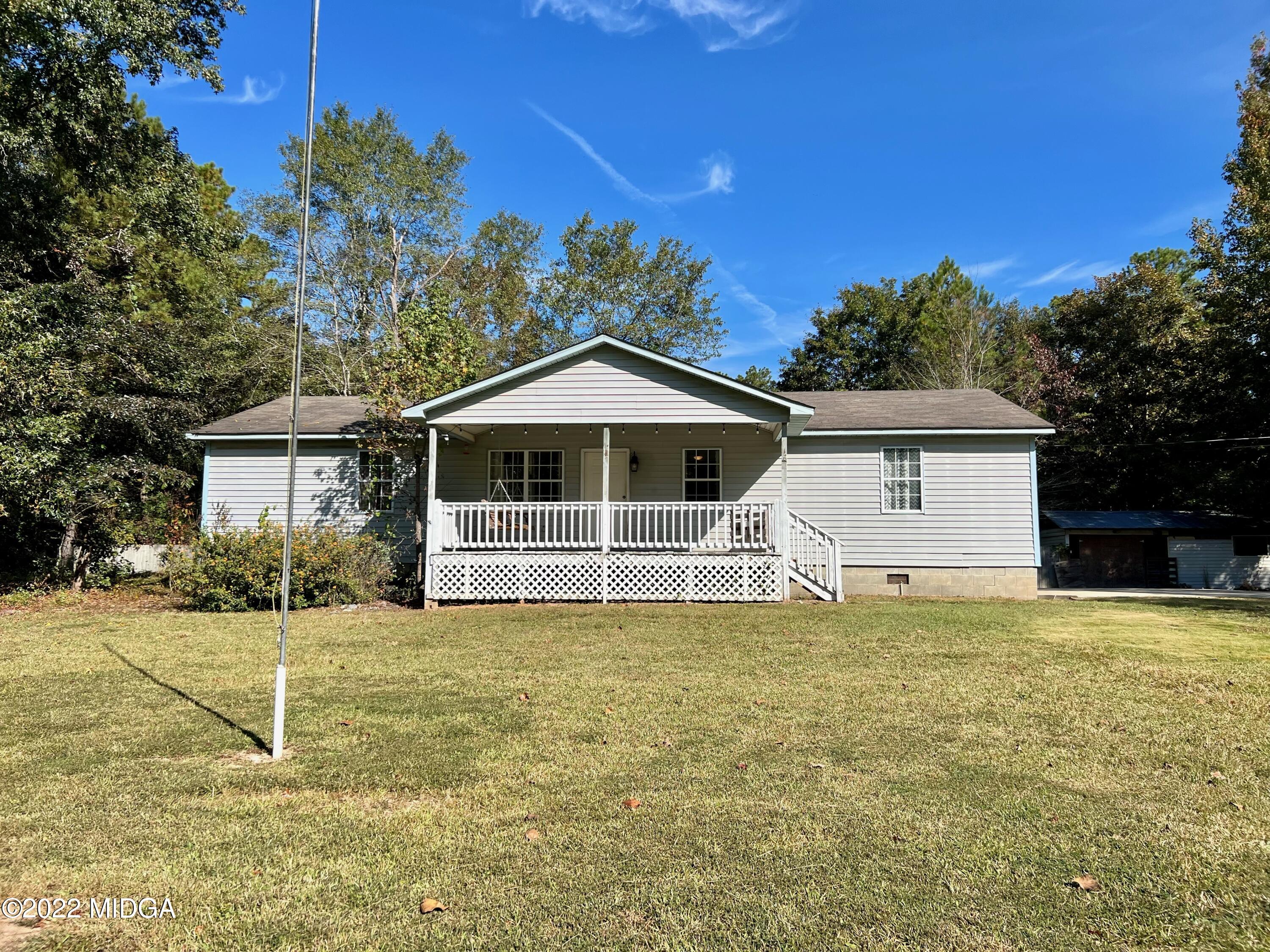 1817 Union Church Road Fort Valley, GA 31030 - Photo 1 of 18 a house that has a big yard in front of it