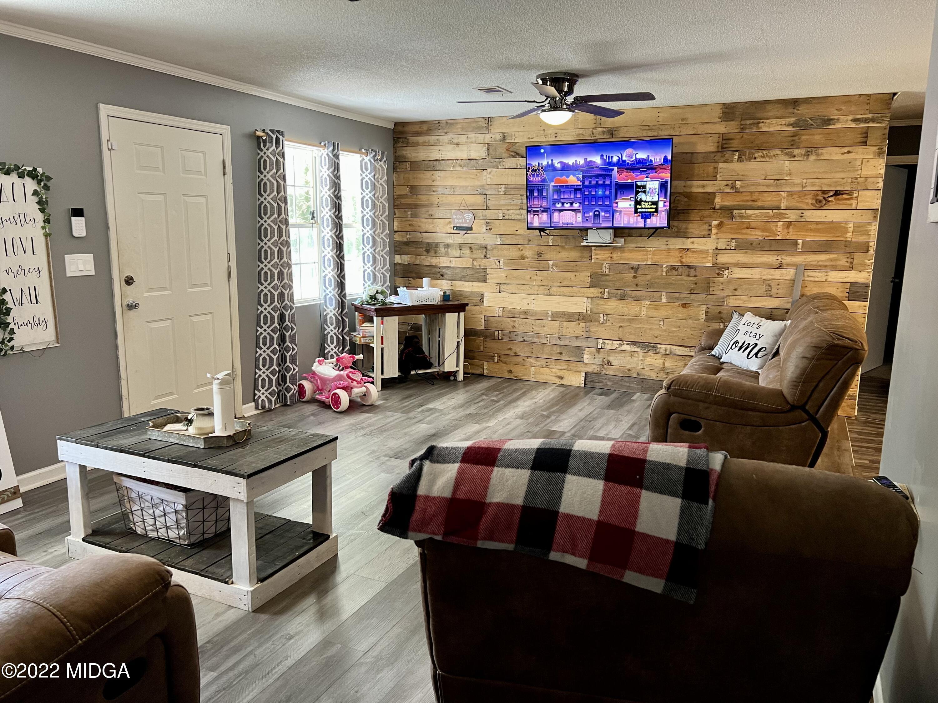 1817 Union Church Road Fort Valley, GA 31030 - Photo 2 of 18 a living room with furniture and a flat screen tv