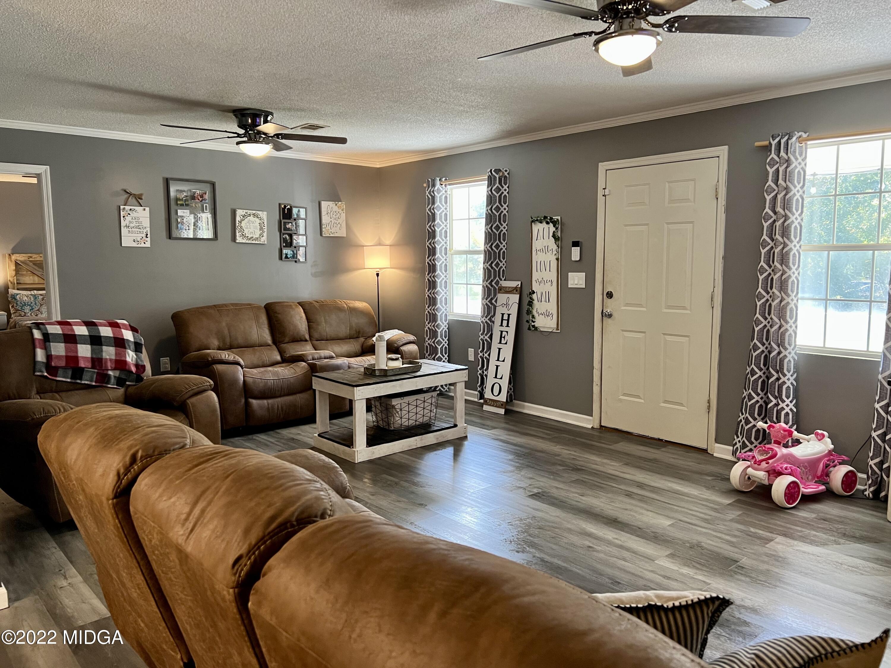 1817 Union Church Road Fort Valley, GA 31030 - Photo 3 of 18 a living room with furniture and a window
