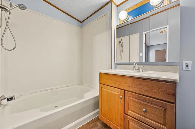 a bathroom with a bathtub and a sink