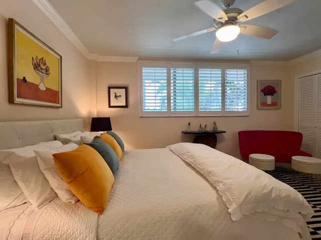 a bedroom with two beds and a couch