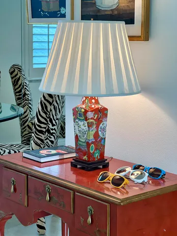 a living room with furniture and flowers