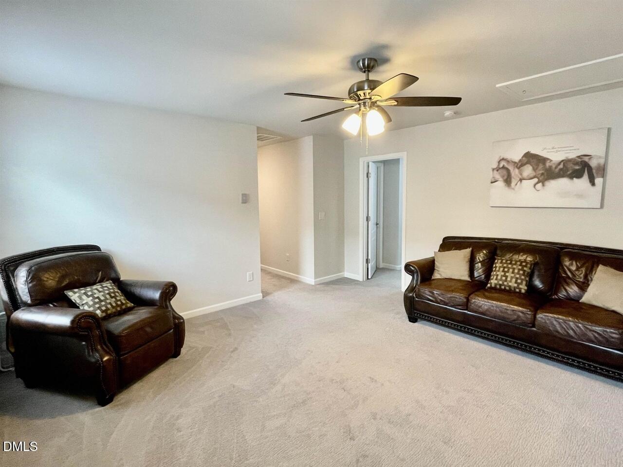 1807 Wrenn Road Durham, NC 27703 - Photo 7 of 43 a living room with furniture and a ceiling fan