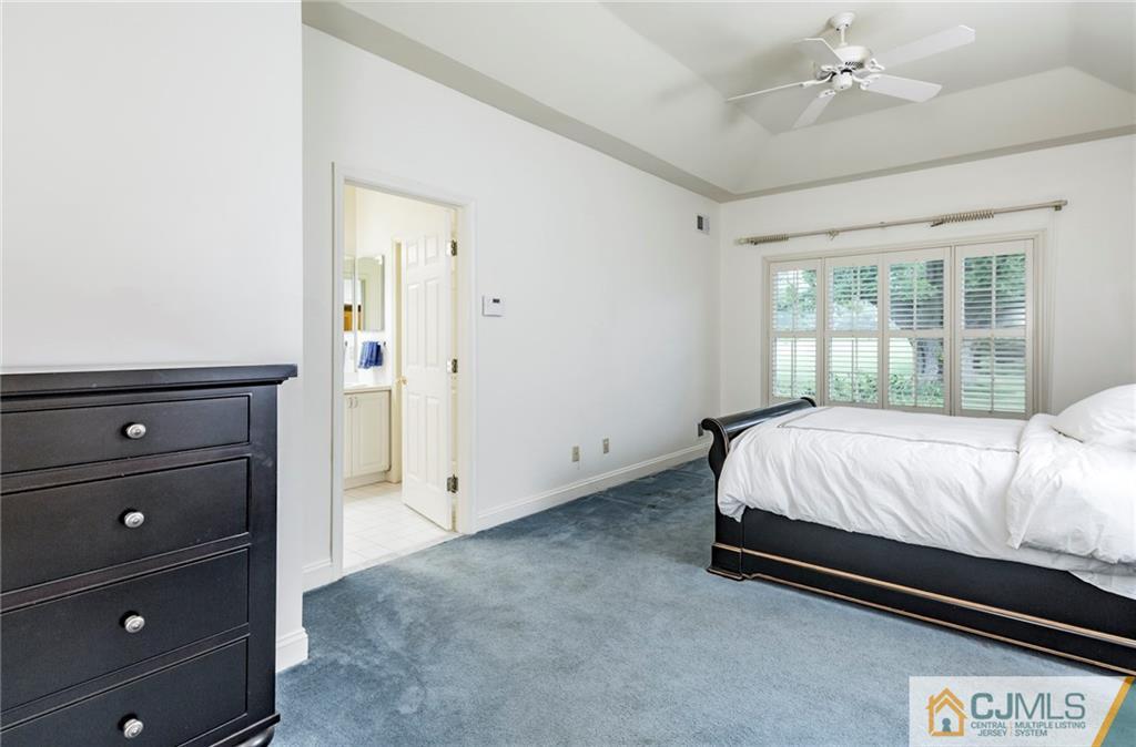 5 Hedge Row Road Plainsboro, NJ 08540 - Photo 11 of 25 a bed sitting in a bedroom next to a window