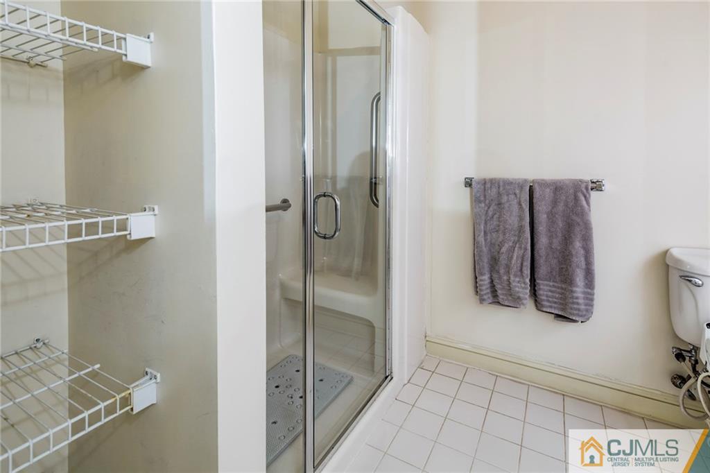 5 Hedge Row Road Plainsboro, NJ 08540 - Photo 13 of 25 a bathroom with a shower and a sink a mirror
