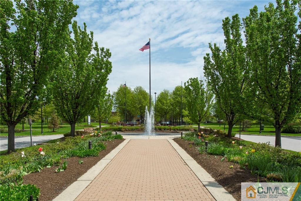 5 Hedge Row Road Plainsboro, NJ 08540 - Photo 21 of 25 a view of a park with large trees and a pathway