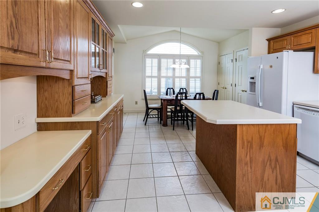 5 Hedge Row Road Plainsboro, NJ 08540 - Photo 7 of 25 a kitchen with stainless steel appliances granite countertop a stove a sink a refrigerator and island