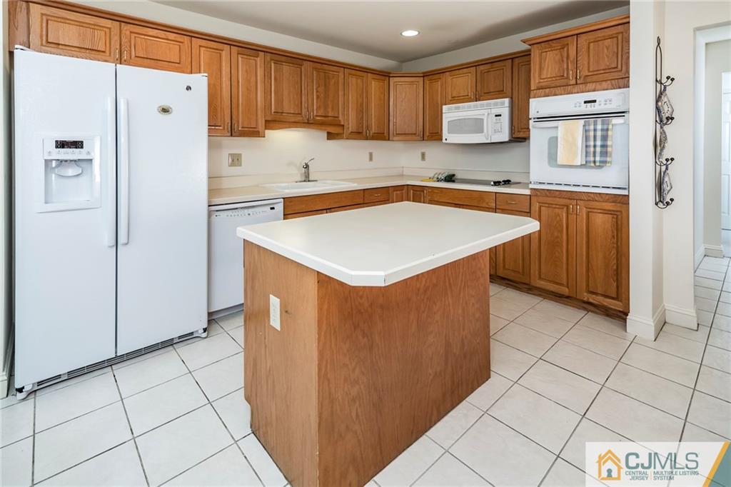 5 Hedge Row Road Plainsboro, NJ 08540 - Photo 9 of 25 a kitchen with stainless steel appliances a refrigerator sink and cabinets