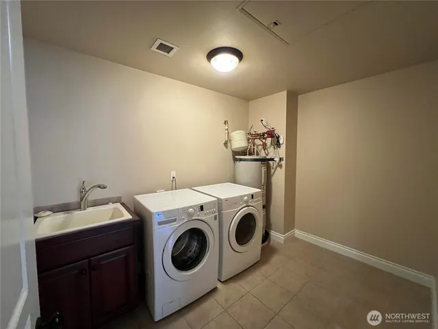 a utility room with dryer and washer