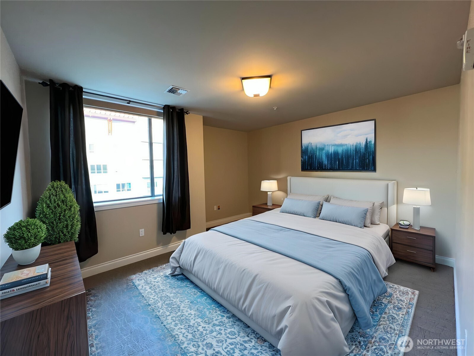 505 Broadway, Unit 802 Tacoma, WA 98402 - Photo 14 of 23 a bedroom with a large bed and a window