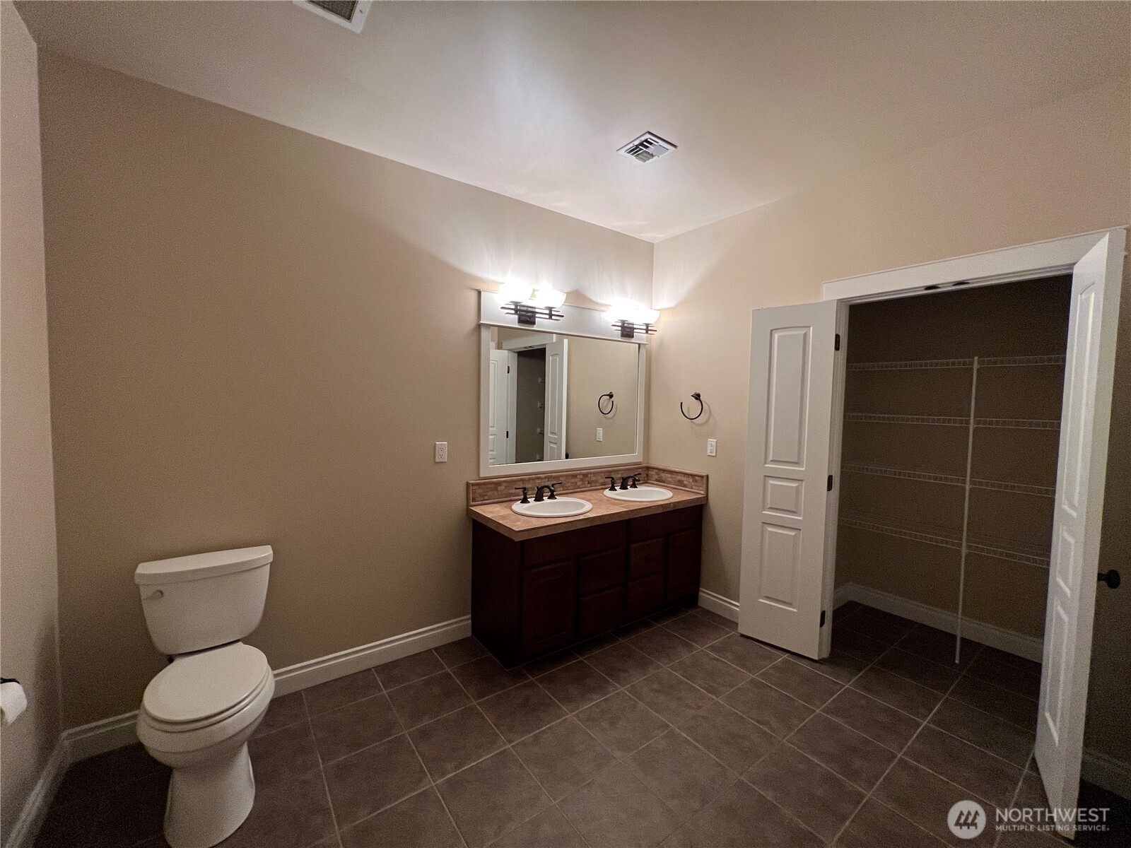 505 Broadway, Unit 802 Tacoma, WA 98402 - Photo 16 of 23 a bathroom with a sink a toilet and shower