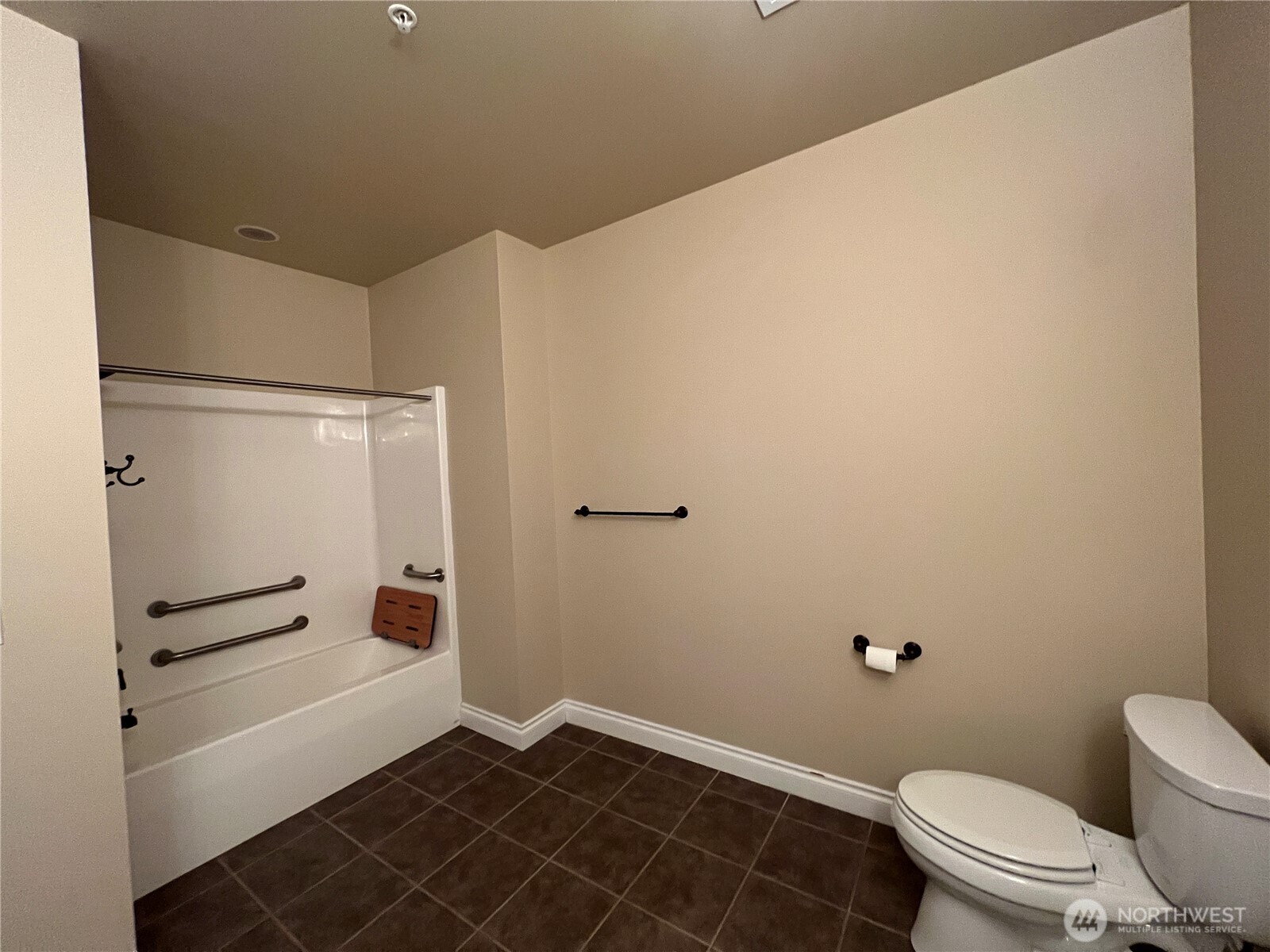 505 Broadway, Unit 802 Tacoma, WA 98402 - Photo 17 of 23 a bathroom with a toilet and a shower