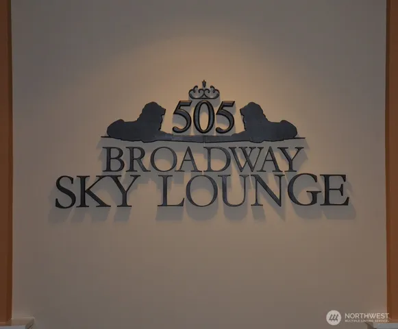 a living room with furniture a flat screen tv and a window