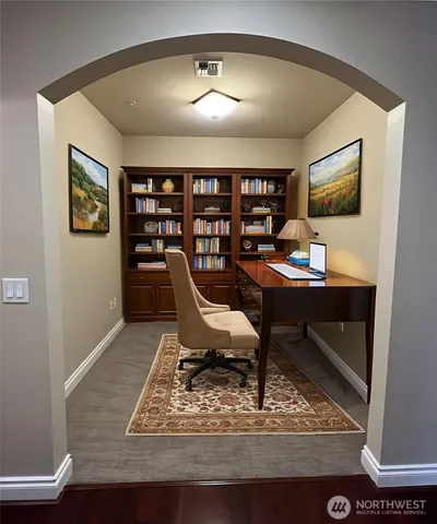 a workspace with furniture and window