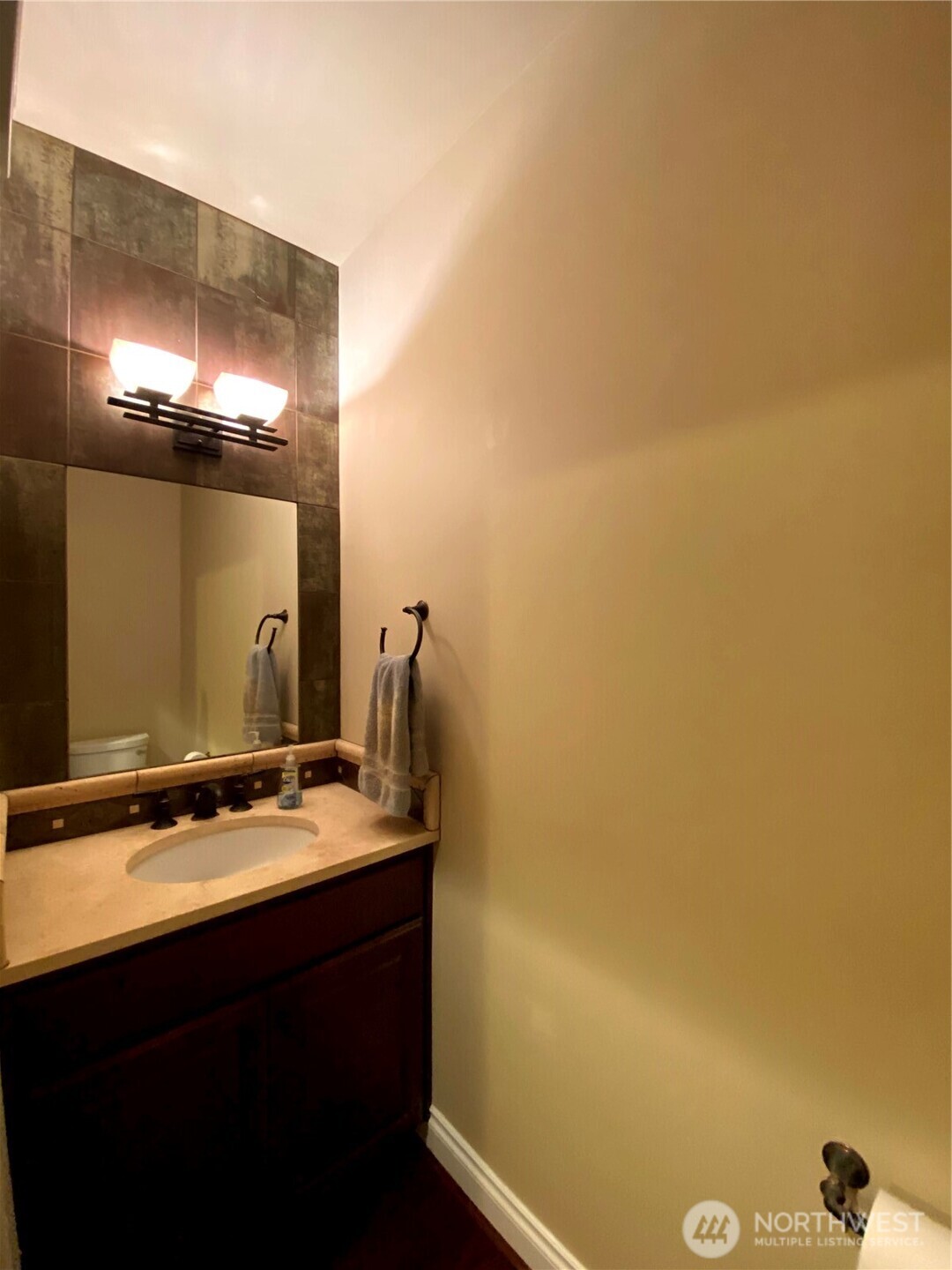 505 Broadway, Unit 802 Tacoma, WA 98402 - Photo 10 of 23 a bathroom with a sink and a mirror
