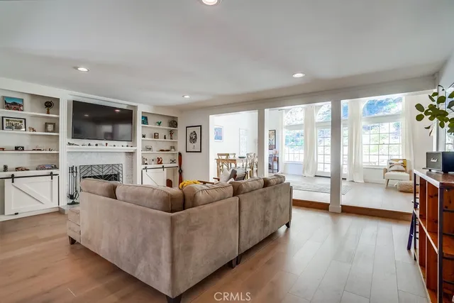 a dining room with furniture and a kitchen view