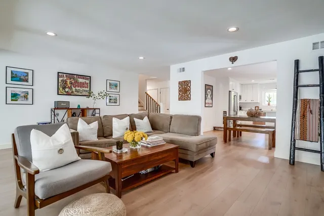 a bathroom with a granite countertop toilet and a shower