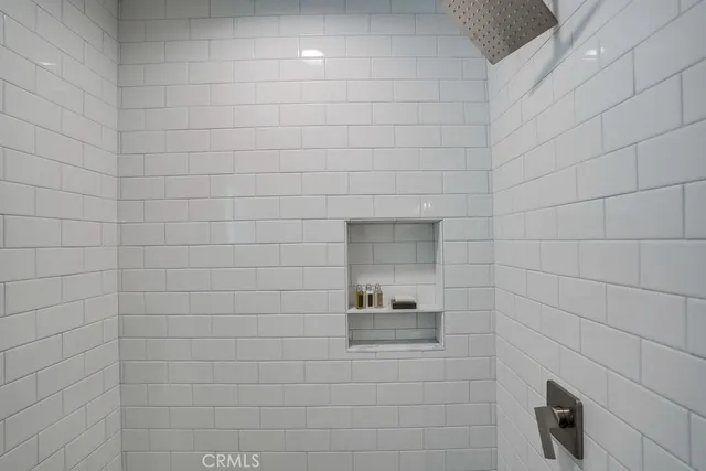 a spacious bedroom with a bed and a couch