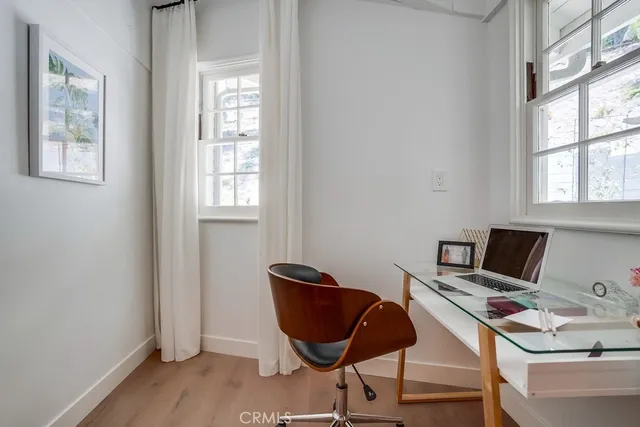 a bathroom with a granite countertop sink a toilet and a mirror
