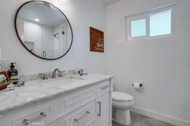 a view of a patio with table and chairs and potted plants
