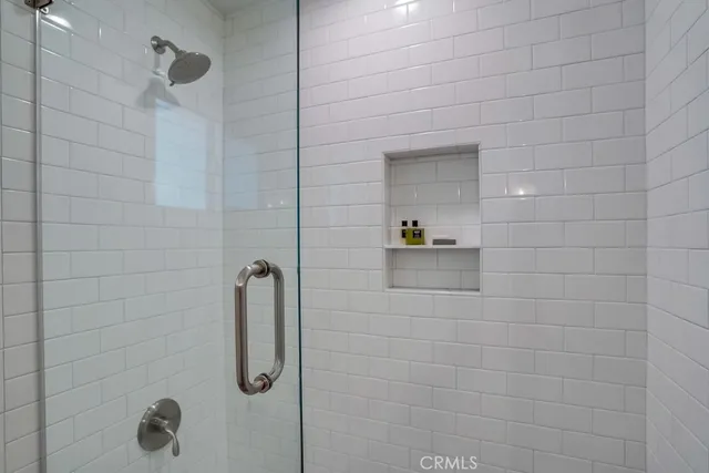 a view of a patio with table and chairs and potted plants