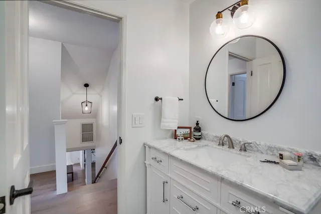 a view of an outdoor sitting area with furniture and wooden fence