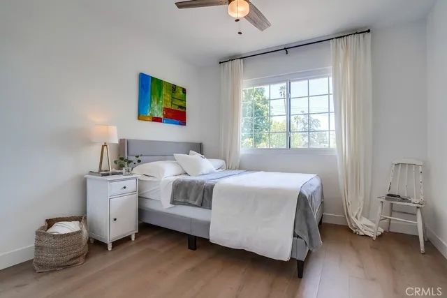a backyard of a house with barbeque oven table and chairs