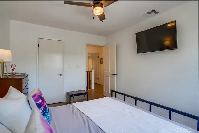 a view of a livingroom with furniture and a flat screen tv