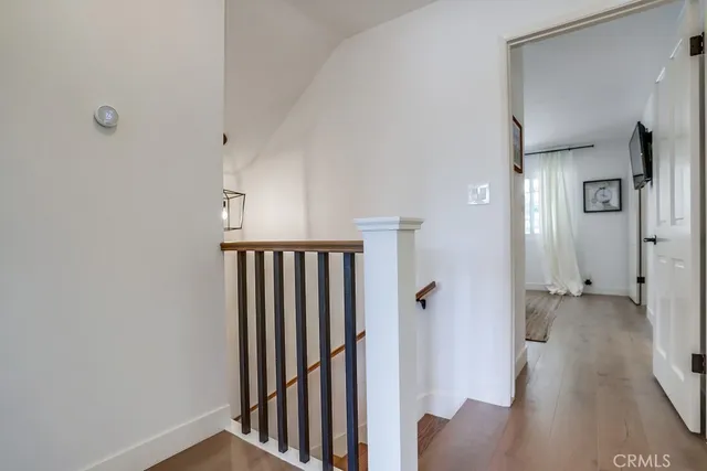 a kitchen with stainless steel appliances a stove a sink cabinets and a window