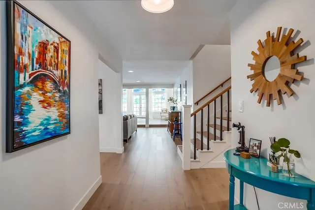 a kitchen with cabinets stainless steel appliances a sink and a window