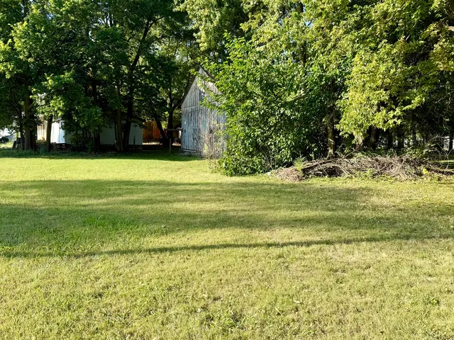 a view of a golf course with a trees
