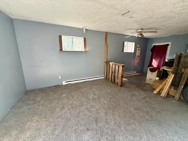 a view of livingroom with hardwood floor and workspace