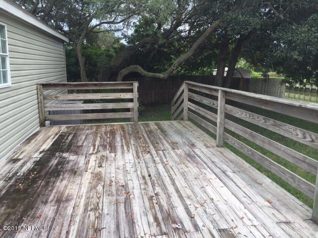217 Barco Road St. Augustine, FL 32080 - Photo 14 of 18 a view of backyard with deck and wooden floor