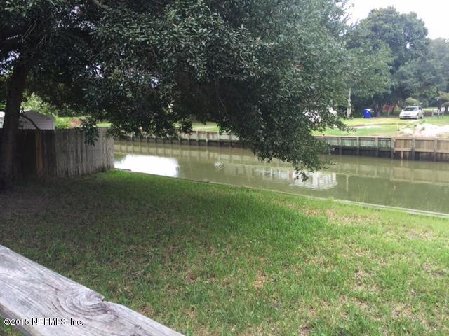 217 Barco Road St. Augustine, FL 32080 - Photo 17 of 18 a view of a lake with a yard and large trees