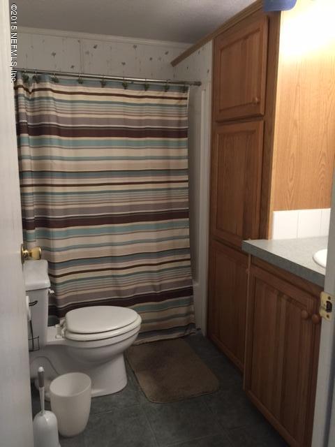 217 Barco Road St. Augustine, FL 32080 - Photo 8 of 18 a bathroom with a toilet and a shower