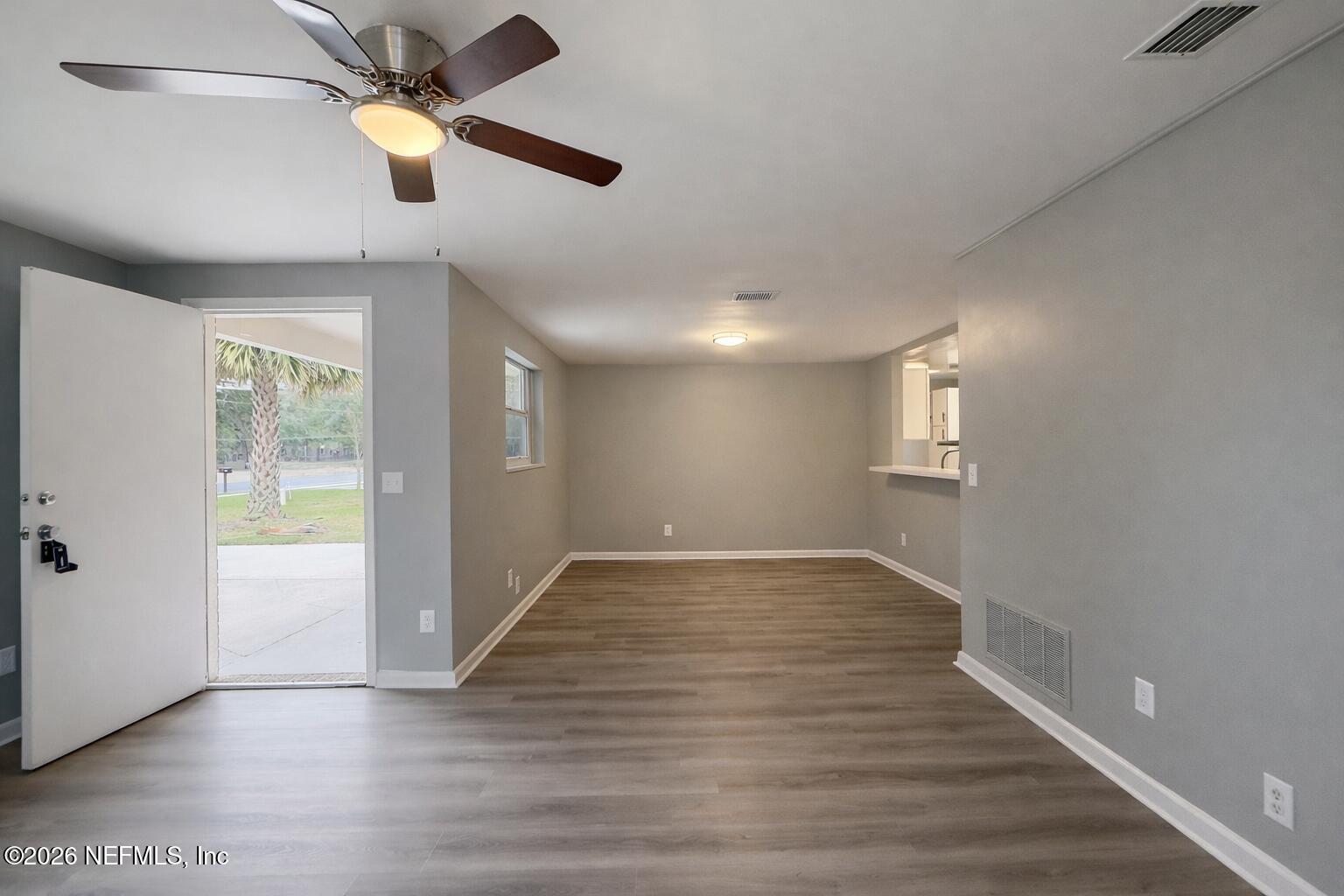 814 Greeland Avenue Jacksonville, FL 32221 - Photo 5 of 17 wooden floor in an empty room with a window