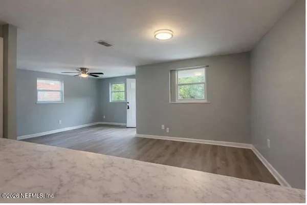 an empty room with windows