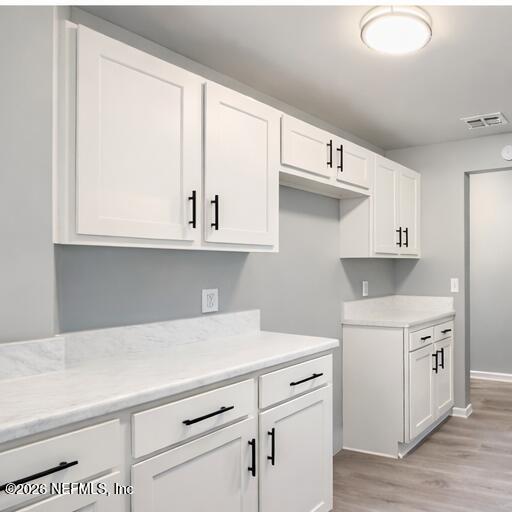 814 Greeland Avenue Jacksonville, FL 32221 - Photo 10 of 17 a kitchen with stainless steel appliances white cabinets and a sink