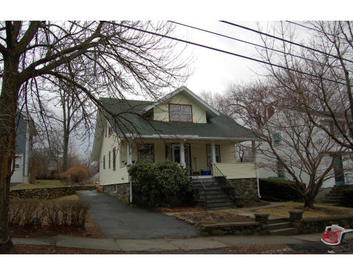 67 Overlook Road Arlington, MA 02474 - Photo 1 of 10 a front view of a house with a yard