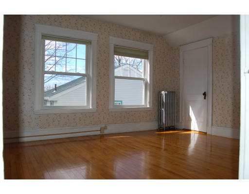 67 Overlook Road Arlington, MA 02474 - Photo 7 of 10 a view of an empty room with wooden floor and a window