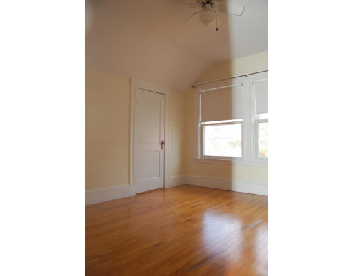 67 Overlook Road Arlington, MA 02474 - Photo 8 of 10 a view of an empty room with wooden floor and a window