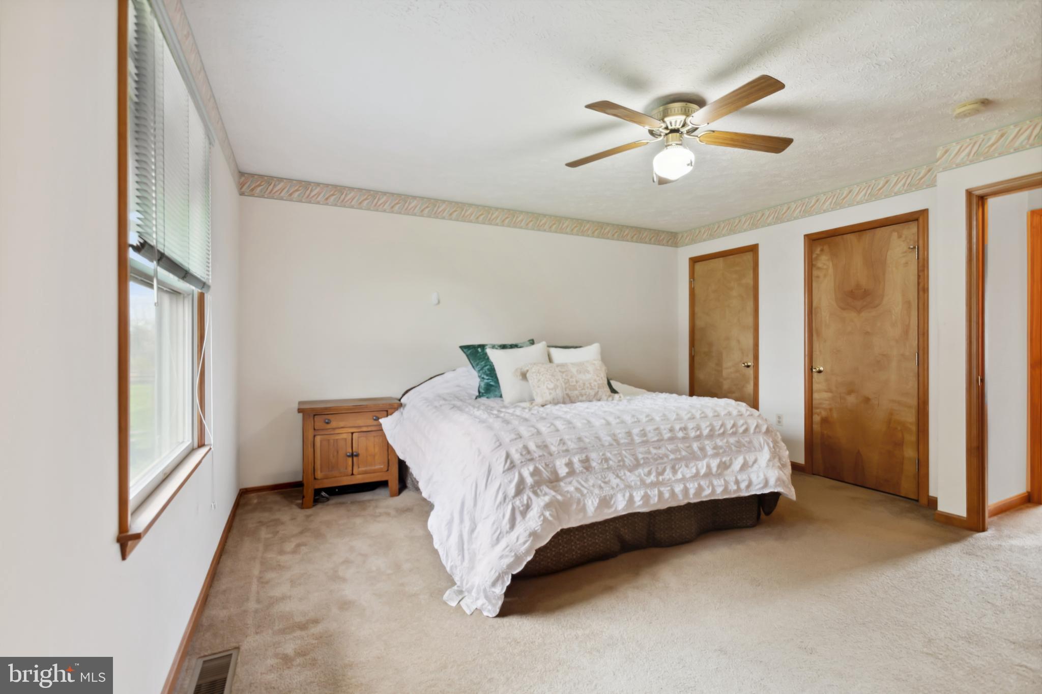 75 Loft House Road Rising Sun, MD 21911 - Photo 8 of 18 a bedroom with a bed and window