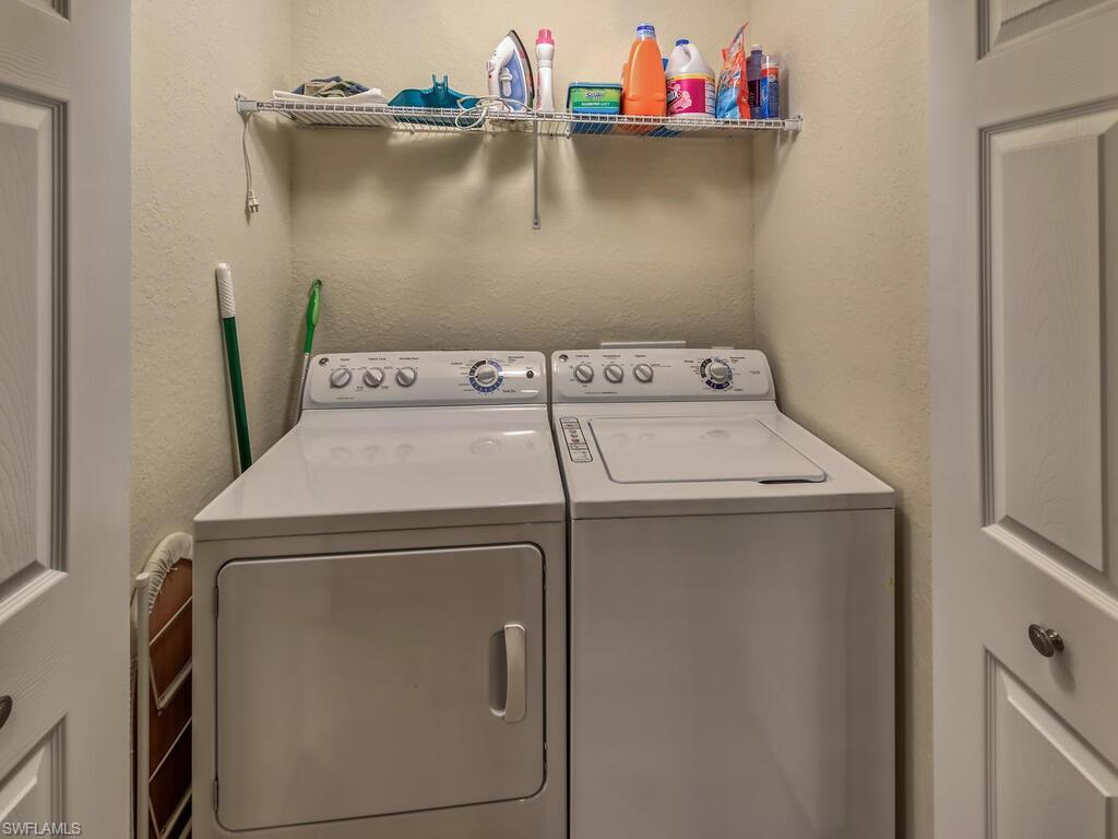9735 Acqua Court, Unit 635 Naples, FL 34113 - Photo 17 of 33 a utility room with dryer and washer